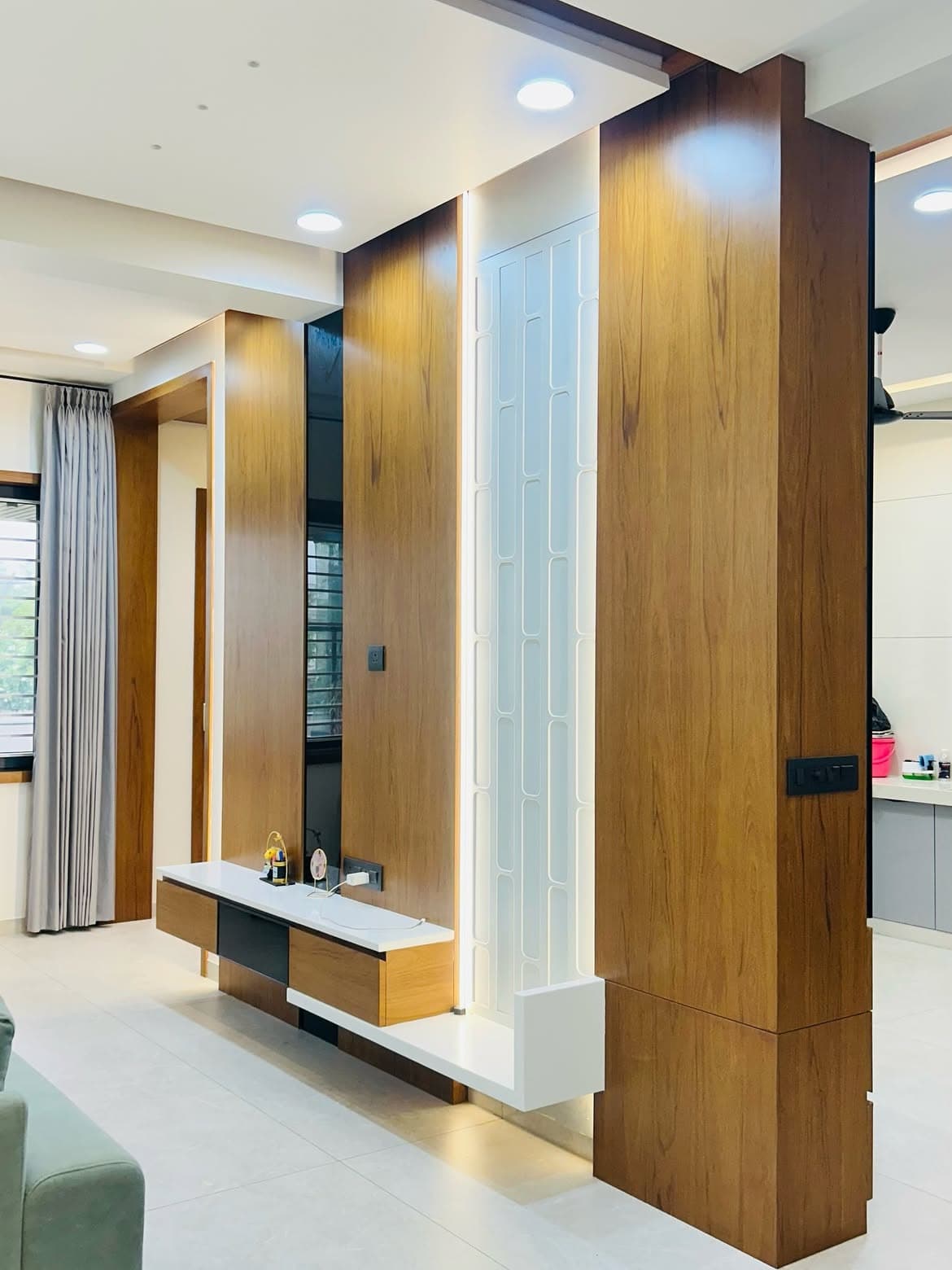 Bedroom with custom storage, soft wall panelling and layered light