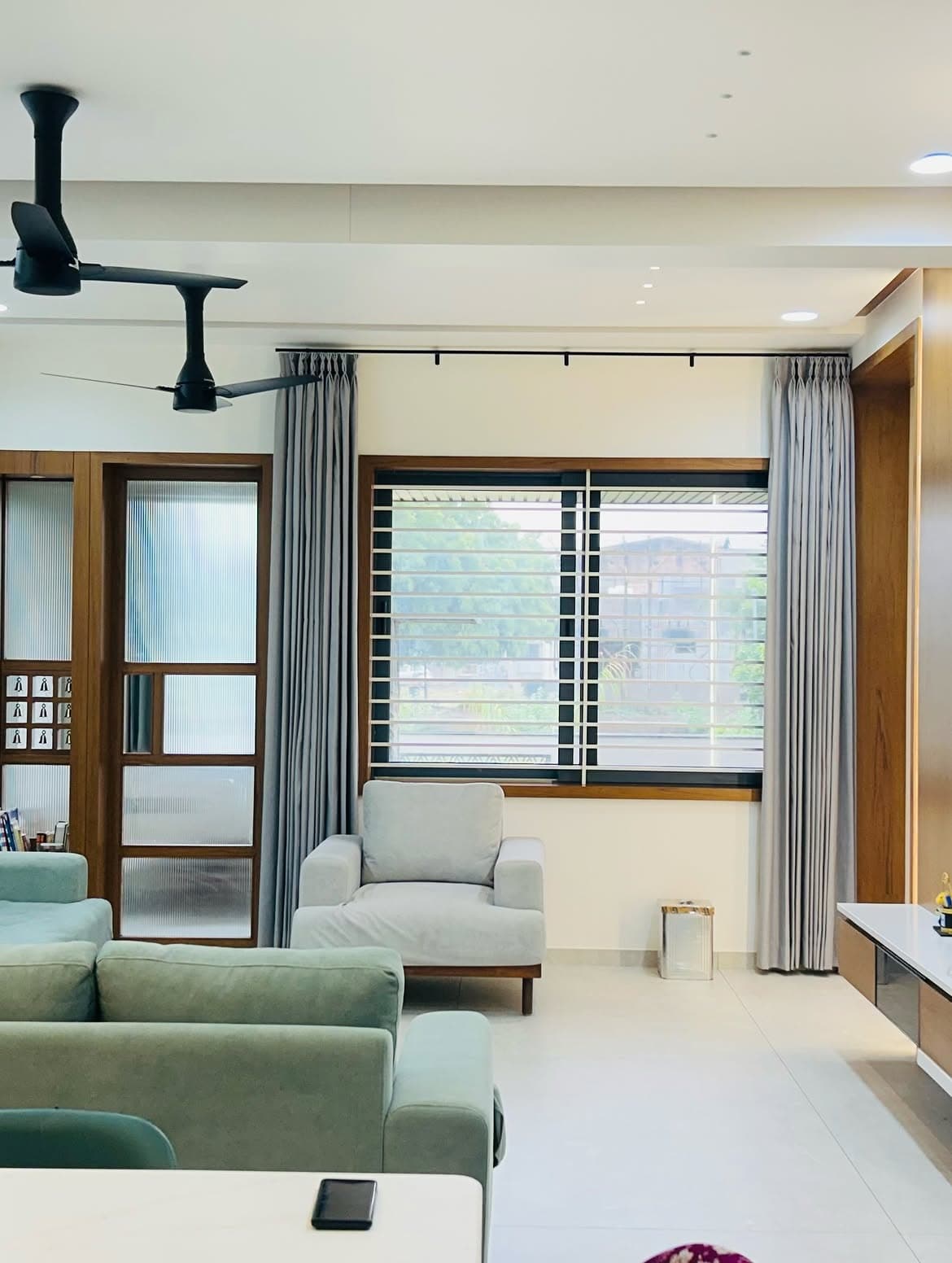 Interior corner with a framed artwork and built-in cabinetry