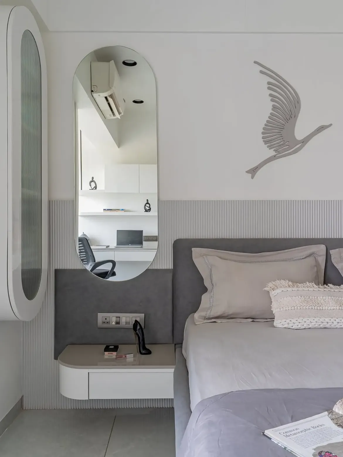 Bedroom render with a floral feature wall, integrated wardrobes and warm lighting